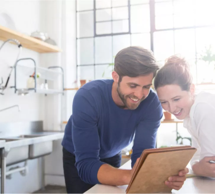 couple in kitchen ordering nestle pure life bottled water water online